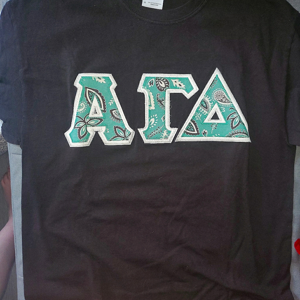 Alpha Gamma Delta stitched letters